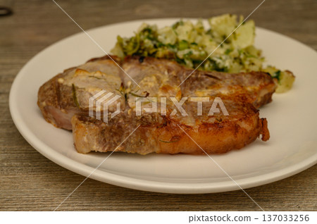 Oven-Baked Pork Steak with Braised Cauliflower Broccoli Medley 137033256