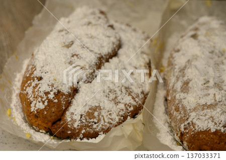 German Christmas Stollen with Curd Cheese on Kitchen Table Traditional Holiday Bread 137033371