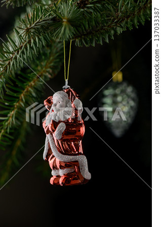 Charming Santa Ornament Holding Teddy on Christmas Tree Branch Charming Santa Ornament Holding Teddy on Christmas Tree Branch 137033387