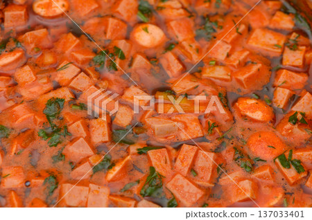 Hearty Tomato Lentil Soup with Sausage Detailed Close-Up Hearty Tomato Lentil Soup with Sausage Detailed Close-Up 137033401