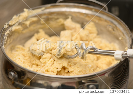 Blending Christmas Stollen Dough Hand Mixer at Work Blending Christmas Stollen Dough Hand Mixer at Work 137033421