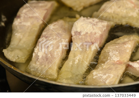 Crispy Tilapia Fillets Cooking in a Skillet Crispy Tilapia Fillets Cooking in a Skillet 137033449