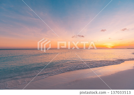 Sunset beach closeup calm ocean waves sandy shore romantic sky summer nature 137033513