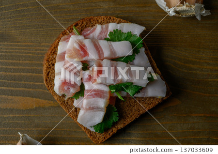 Dark Rye Bread with Cured Salo on Weathered Wood Dark Rye Bread with Cured Salo on Weathered Wood 137033609