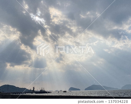 Angel's ladder pouring into the sea Angel's ladder pouring into the sea 137034228