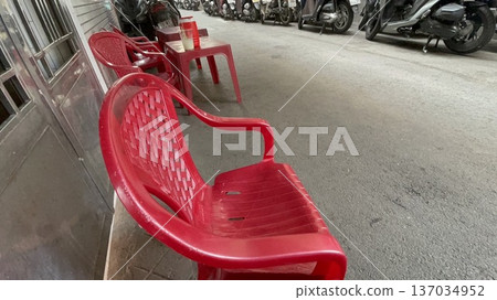 Chairs lined up on the side of the road in Ho Chi Minh City, Vietnam 137034952