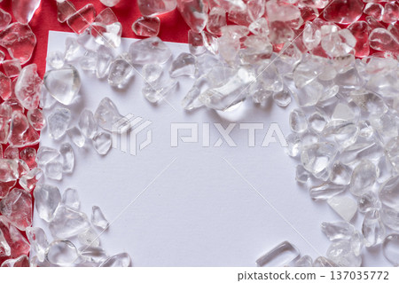 White card and crystal on red background White card and crystal on red background 137035772