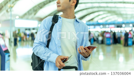 A man waiting to go through procedures at the airport. Photo courtesy of Kansai International Airport (KIX). A man waiting to go through procedures at the airport. Photo courtesy of Kansai International Airport (KIX). 137036004