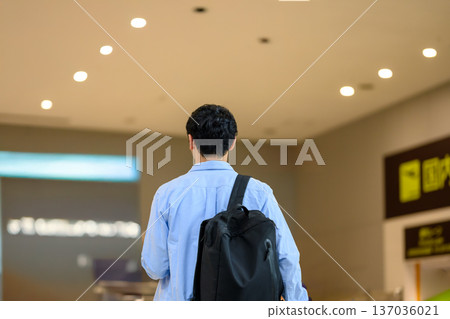 A man walking through the airport. Photo courtesy of Kansai International Airport (KIX). A man walking through the airport. Photo courtesy of Kansai International Airport (KIX). 137036021