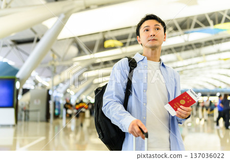 A man leaving at the airport. Photo courtesy of Kansai International Airport (KIX) A man leaving at the airport. Photo courtesy of Kansai International Airport (KIX) 137036022