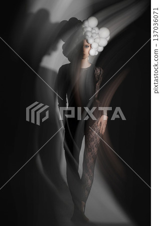 Woman posing avant-garde fashion with white spheres Woman posing avant-garde fashion with white spheres 137036071