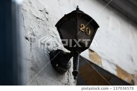 Number 20 on a Wall Lamp in a Street Setting Number 20 on a Wall Lamp in a Street Setting 137036578
