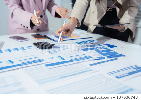 Project manager working and update tasks with milestones progress planning and professional investor working new start up project in the office Project manager working and update tasks with milestones progress planning and professional investor working new start up project in the office 137036748