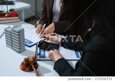 Justice and law concept. Real Estate Law in a courtroom the gavel, working with digital tablet computer. Justice and law concept. Real Estate Law in a courtroom the gavel, working with digital tablet computer. 137036751
