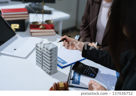 Justice and law concept. Real Estate Law in a courtroom the gavel, working with digital tablet computer. Justice and law concept. Real Estate Law in a courtroom the gavel, working with digital tablet computer. 137036752