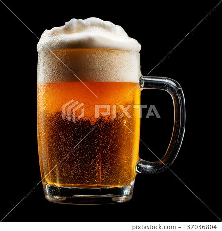 Foamy amber ale beer in a mug glass with creamy foam head, isolated on black background, concept of refreshment and taste Foamy amber ale beer in a mug glass with creamy foam head, isolated on black background, concept of refreshment and taste 137036804