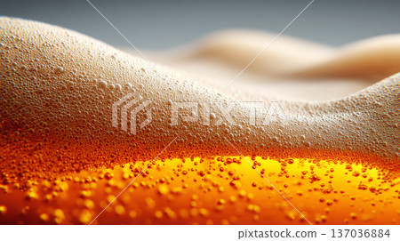 Closeup view of curved beer foam and golden bubbles on warm blurred background, expressing freshness concept 137036884