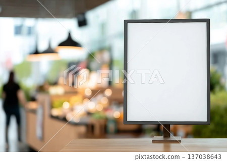 mockup white poster with black frame stand in front of blur restaurant cafe background for show or present promotion product concept 137038643