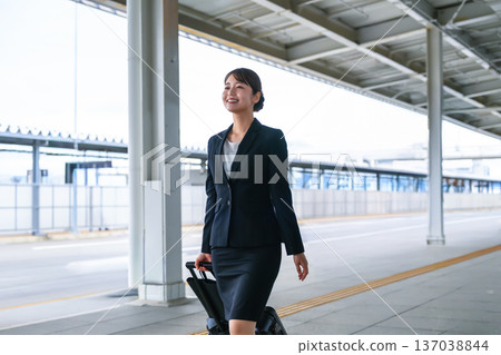 A woman pulling a suitcase at the station. Photo courtesy of Kansai International Airport (KIX) A woman pulling a suitcase at the station. Photo courtesy of Kansai International Airport (KIX) 137038844