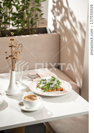 Flat croissant breakfast with poached egg and greens 137038926