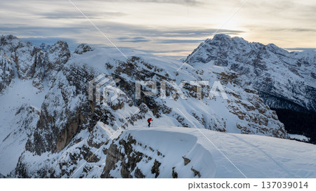 Beautiful Winter Dolomite Mountain Scenery with Man on Cross-Country Skis , Aerial View Beautiful Winter Dolomite Mountain Scenery with Man on Cross-Country Skis , Aerial View 137039014