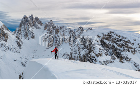 Beautiful Winter Dolomite Mountain Scenery with Man on Cross-Country Skis , Aerial View Beautiful Winter Dolomite Mountain Scenery with Man on Cross-Country Skis , Aerial View 137039017