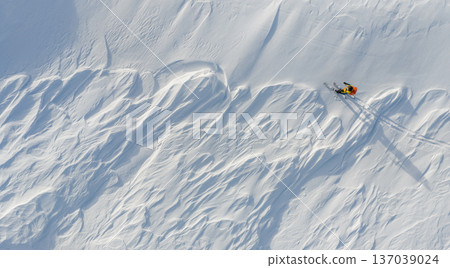 Beautiful Winter Dolomite Mountain Scenery with Man on Cross-Country Skis , Aerial View 137039024