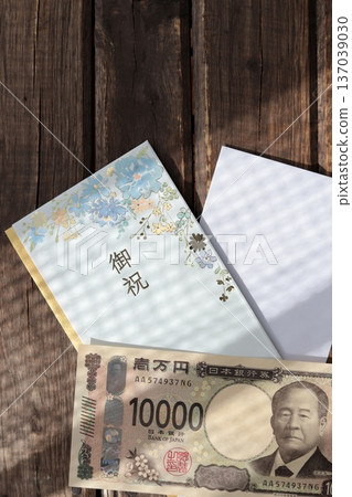 Light blue floral gift envelope and new 10,000 yen bill - Japanese customs Light blue floral gift envelope and new 10,000 yen bill - Japanese customs 137039030