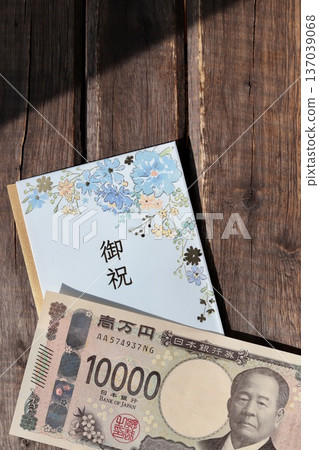 A light blue floral gift envelope and a new 10,000 yen bill 137039068