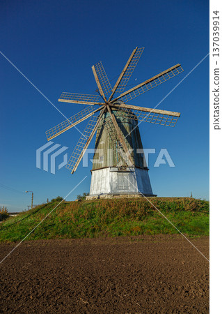 windmill dutch type against blue sky 137039914