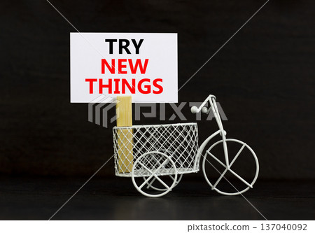 Try new things symbol. Concept words Try new things on beautiful white paper on wooden clothespin. Beautiful black background. Business motivational lifestyle try new things concept. Copy space. 137040092