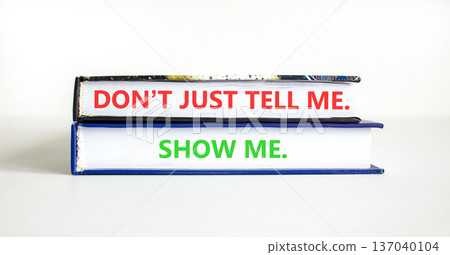 Tell or show symbol. Concept words Do not just tell me, show me on beautiful books. Beautiful white paper background. Business tell or show concept. Copy space. Tell or show symbol. Concept words Do not just tell me, show me on beautiful books. Beautiful white paper background. Business tell or show concept. Copy space. 137040104