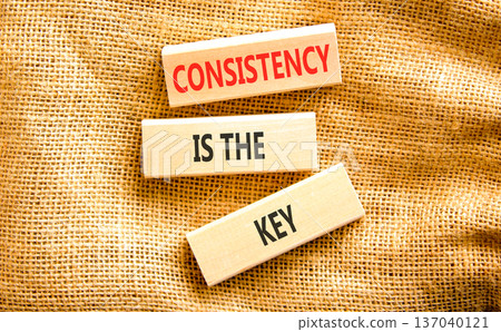 Consistency is the key symbol. Concept words Consistency is the key on beautiful wooden blocks. Beautiful canvas background. Business consistency is the key concept. Copy space. 137040121