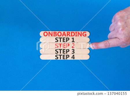 Time to step 2 onboarding symbol. Concept words Onboarding step 2 on beautiful wooden block. Businessman's hand. Beautiful blue background. Business success step 2 onboarding concept. Copy space. Time to step 2 onboarding symbol. Concept words Onboarding step 2 on beautiful wooden block. Businessman's hand. Beautiful blue background. Business success step 2 onboarding concept. Copy space. 137040155