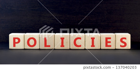 Policies word symbol. Concept word Policies on beautiful wooden blocks. Beautiful black background. Business support help policies word concept. Copy space. 137040203