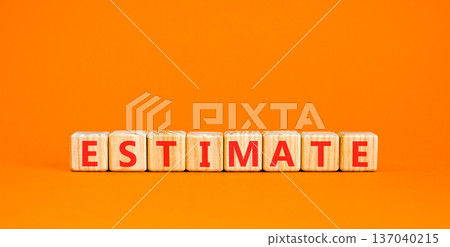 Estimate word symbol. Concept word Estimate on beautiful wooden blocks. Beautiful orange background. Business support help estimate word concept. Copy space. 137040215
