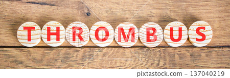 Thrombus word symbol. Concept word Thrombus on beautiful wooden circles. Beautiful wooden background. Business medical support help thrombus word concept. Copy space. 137040219