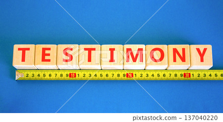 Testimony symbol. Concept word Testimony on beautiful wooden blocks. Beautiful blue background. Beautiful yellow ruler. Business education support testimony concept. Copy space. 137040220
