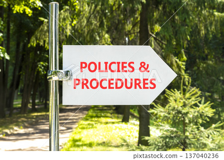 Policies and procedures symbol. Concept words Policies and procedures on beautiful big white road sign. Beautiful green forest garden trees background. Business policies procedures concept. Copy space 137040236