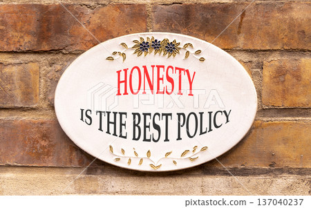 Honesty is the best policy symbol. Concept words Honesty is the best policy on beautiful white sign plate. Beautiful brick wall background. Business honesty is best policy concept. Copy space. Honesty is the best policy symbol. Concept words Honesty is the best policy on beautiful white sign plate. Beautiful brick wall background. Business honesty is best policy concept. Copy space. 137040237
