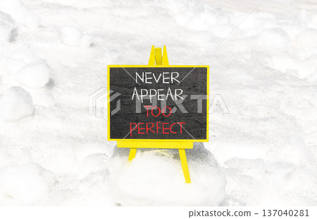 Never appear too perfect symbol. Concept words Never appear too perfect on beautiful black blackboard. Beautiful snow background. Business never appear too perfect concept. Copy space. Never appear too perfect symbol. Concept words Never appear too perfect on beautiful black blackboard. Beautiful snow background. Business never appear too perfect concept. Copy space. 137040281