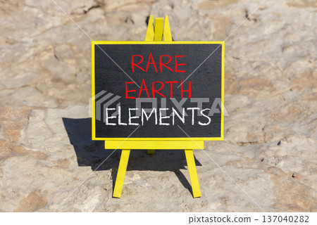 Rare earth elements symbol. Concept words Rare earth elements on beautiful blackboard. Beautiful brown stone beach background. Business and rare earth elements concept. Copy space. Rare earth elements symbol. Concept words Rare earth elements on beautiful blackboard. Beautiful brown stone beach background. Business and rare earth elements concept. Copy space. 137040282