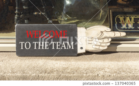 Support, help welcome to the team symbol. Concept words Welcome to the team on beautiful wooden black sign. Beautiful store front background. Business welcome to the team concept. Copy space. Support, help welcome to the team symbol. Concept words Welcome to the team on beautiful wooden black sign. Beautiful store front background. Business welcome to the team concept. Copy space. 137040365