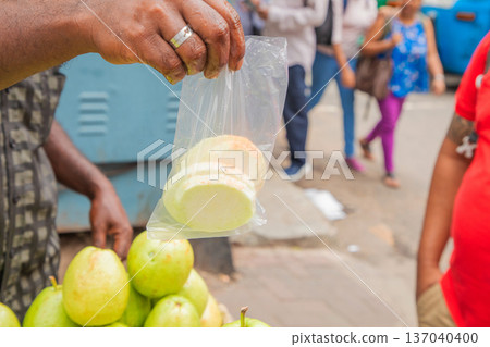 wide variety seasonal vegetables and fruits Crowded central food Market Colombo. 137040400