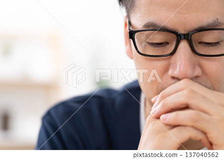Close-up of a worried man Close-up of a worried man 137040562