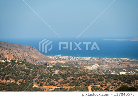 Breathtaking coastal view from the hills of Crete, Greece during a sunny afternoon Breathtaking coastal view from the hills of Crete, Greece during a sunny afternoon 137040573