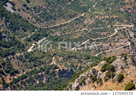 Winding mountain road through the hills of Crete, Greece under the bright sun 137040578