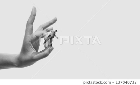 Minimalist composition businessman balancing on fingertip platform Minimalist composition businessman balancing on fingertip platform 137040732