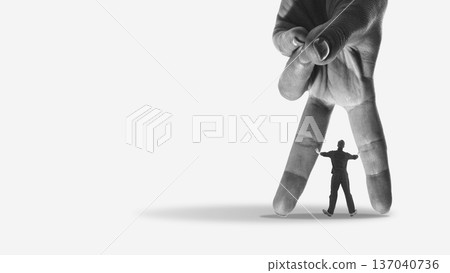 Conceptual mixed media giant hand restricting digital entrepreneur 137040736