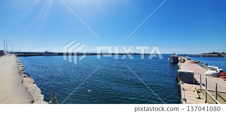 A small seaport on a sunny day. A small seaport on a sunny day. 137041080